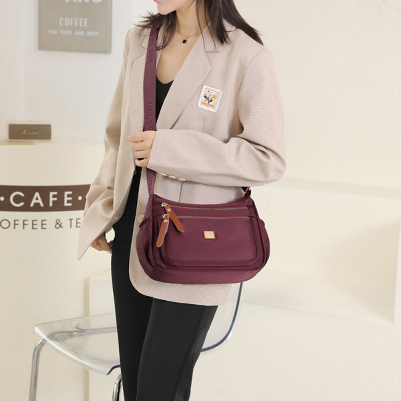 Multi-compartment shoulder bag